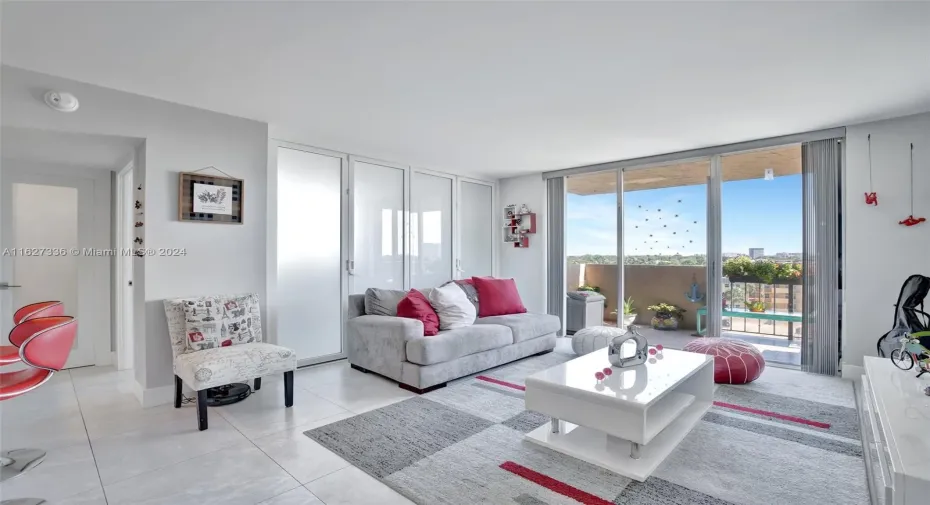 View of living room with the frosted glass doors closed between living room and guest room.