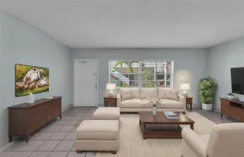 Spacious living room with great natural light and overlooking courtyard - photo is staged