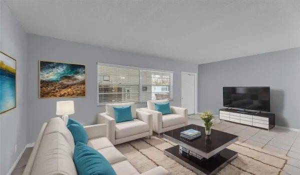 Spacious Living Room with Tile Flooring - staged photo