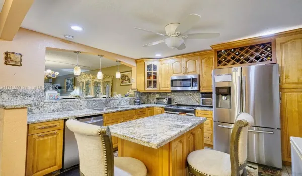 Kitchen shows dining and living room