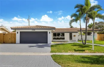 Beautiful Front Entrance, two car garage, stamped concrete driveway.