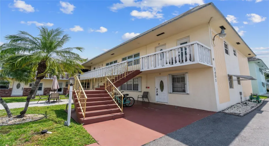 Front of Building with stairs to 2nd floor units