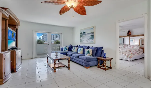 Living room has french doors that open to large balcony