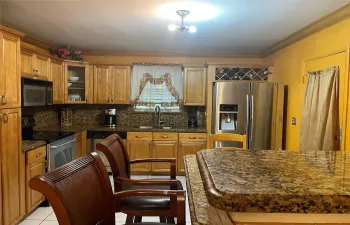 Stainless appliances in large kitchen