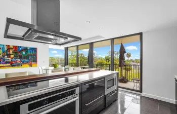 Kitchen with SS cooktop,  undercounter oven, microwave & hood