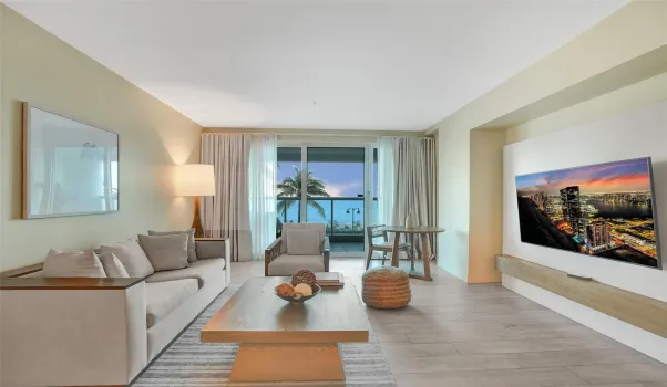 Convertible sofa and partition allows for guest to have a private sleeping space, full bathroom and balcony access