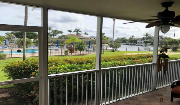 view from patio at living area overlooking pool and waterway