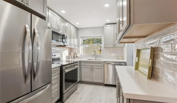 All new soft close cabinets, stainless steel appliances, tile backsplash
