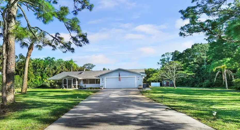 Front of Home with Long Drive and 2 car garage