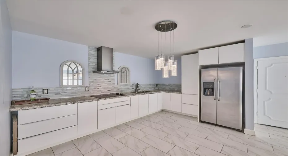 KITCHEN AREA SHOWING: GRANITE, WHITE CABINETS, STAINLESS STEEL APPLIANCES