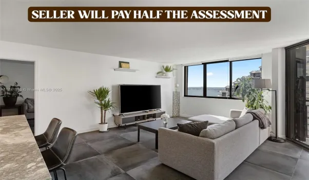 The spacious living area seamlessly connects to a stylish kitchen with high-end finishes, making it perfect for entertaining. Relax while enjoying the picturesque scenery or step onto the balcony for a closer look at the serene waterfront.