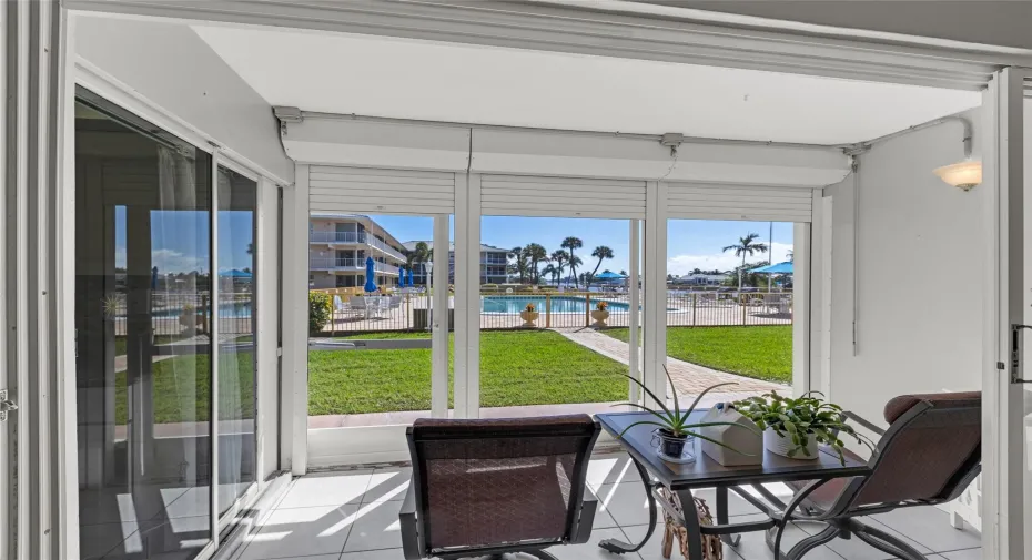 Enjoy this gorgeous screened patio overlooking the pool and water