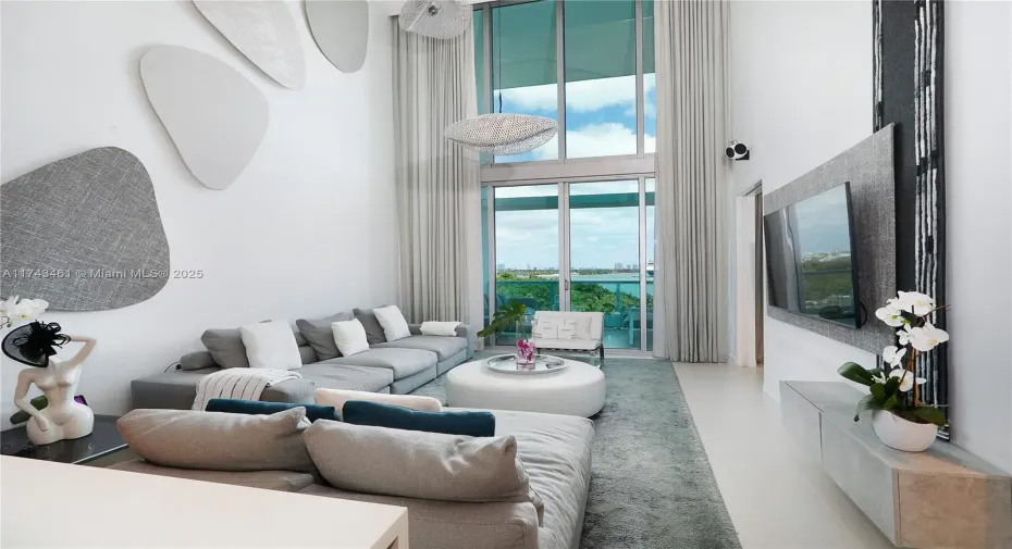 Two-story ceiling in the Living Room with unobstructed water views