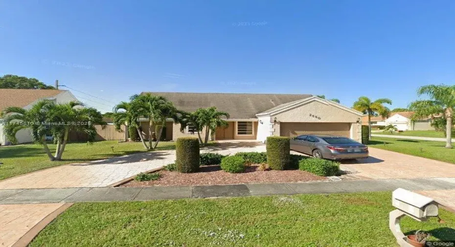 Beautiful landscaping and large circular driveway