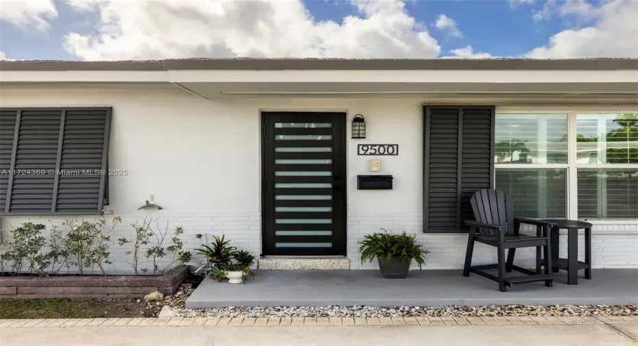 Impact front door leads to spacious floor plan