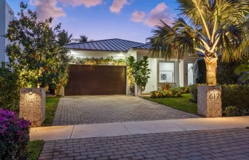 Front of the property during twilight.