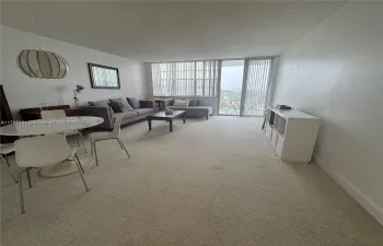 Digital removal of furniture to appreciate bright space on living area
