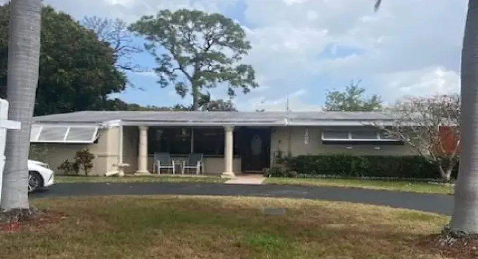 Covered front porch, circular driveway
