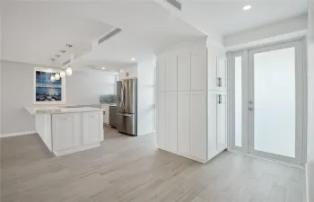 Vast quartz kitchen island, complemented by all-new soft-close cabinets, drawers, top-quality appliances and gorgeous views of the ocean and Lake Mayan.