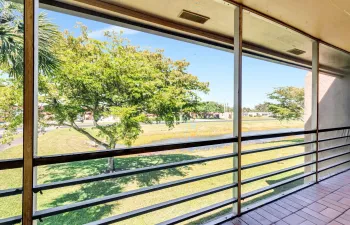  Water and Garden View on this extra long screened balcony