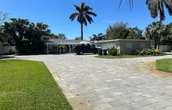clean fresh exterior with paver driveway
