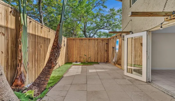 Living room opens to oversize patio.  Ultimate Florida living. Patio is private and secure.  And has an outdoor shower!!!