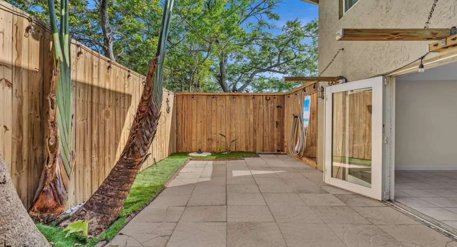 Living room opens to oversize patio.  Ultimate Florida living. Patio is private and secure.  And has an outdoor shower!!!
