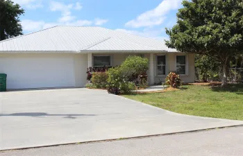 Front View, beautifully landscaped -two car garage & wide concrete driveway