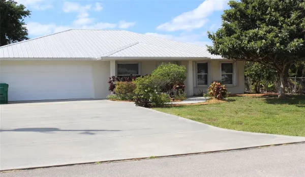 Front View, beautifully landscaped -two car garage & wide concrete driveway