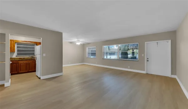 Spacious living room / dining room of this great 2 bed/2 bath unit with wood-like flooring, freshly painted and located on the first floor