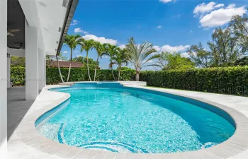 Experience the ultimate backyard  retreat with stunning free-form pool and heated sauna, all set against a lush privacy hedge that creates a serene, secluded oasis perfect for relaxation and entertaining.
Experience the ultimate backyard retreat with a stunning free-form pool and heated sauna, all set against a lush privacy hedge that creates a serene, secluded oasis perfect for relaxation and entertaining.